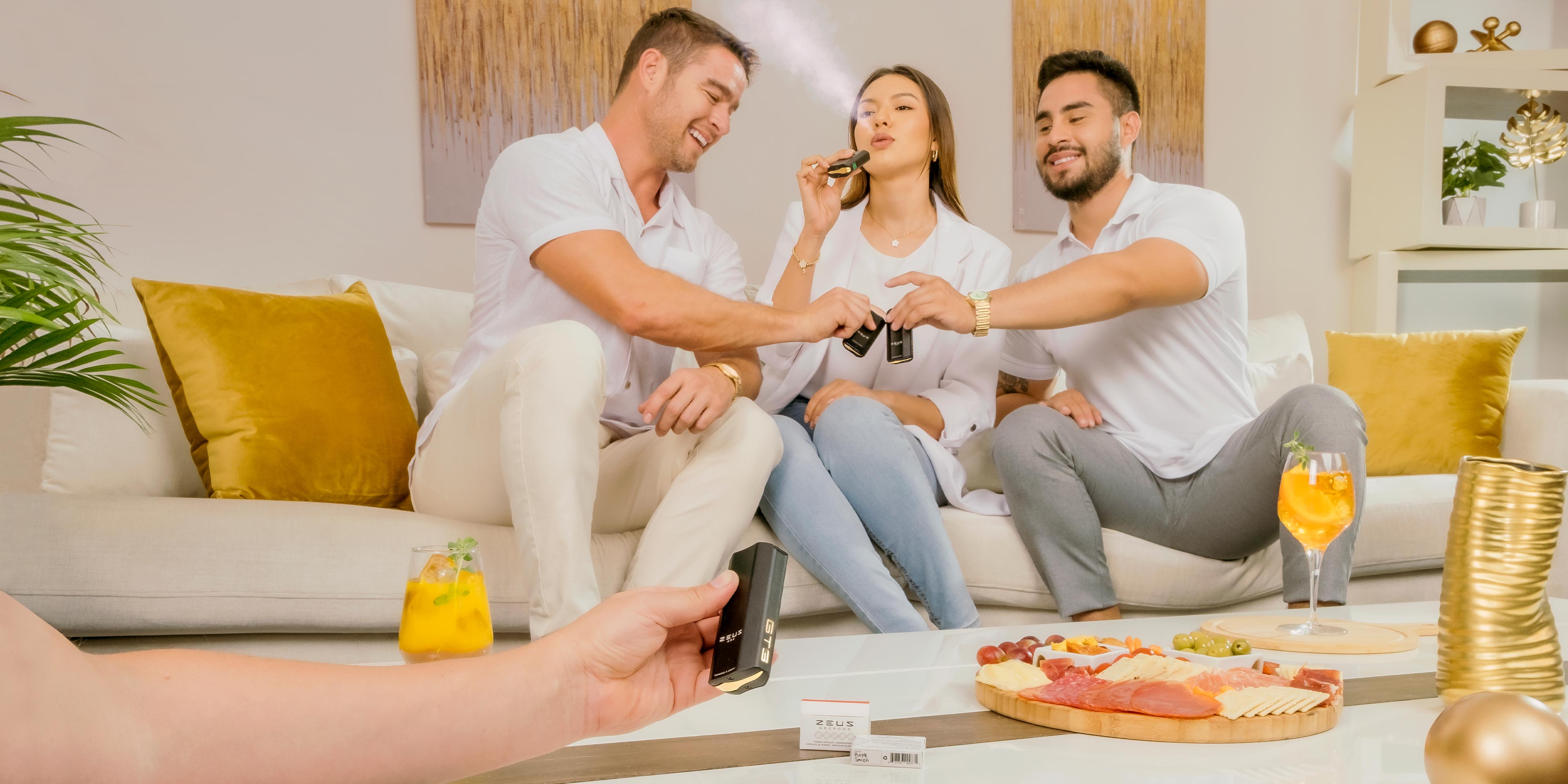 A group of friends cheers at a party with their Zeus Arc GTS devices.